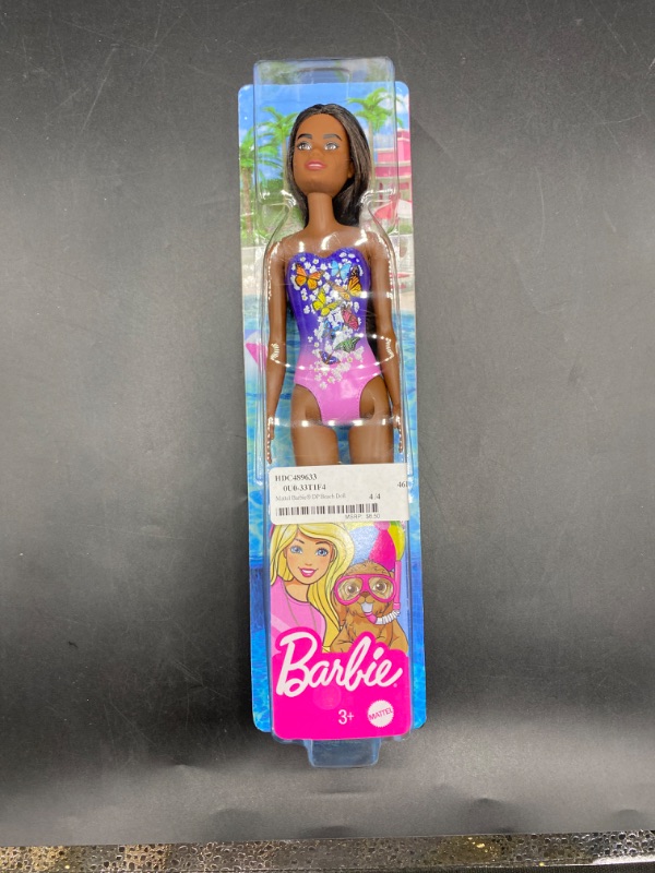 Photo 1 of Barbie Beach Doll in Purple Butterfly Swimsuit with Straight Black Hair
