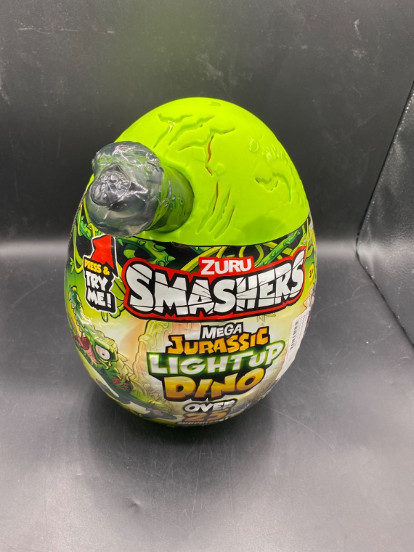 Photo 2 of Smashers Mega Jurassic Light up Dino Egg by ZURU T-Rex or Spino Dinosaur Toy for Child 3 Years and up
