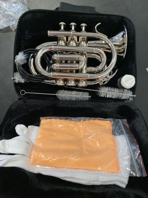 Photo 2 of EastRock Pocket Trumpet Brass Bb Nickel Plated Trumpet with 7 C Mouthpiece, Hard Case, Strap, White Gloves, Cleaning Kit for Students and Beginners
