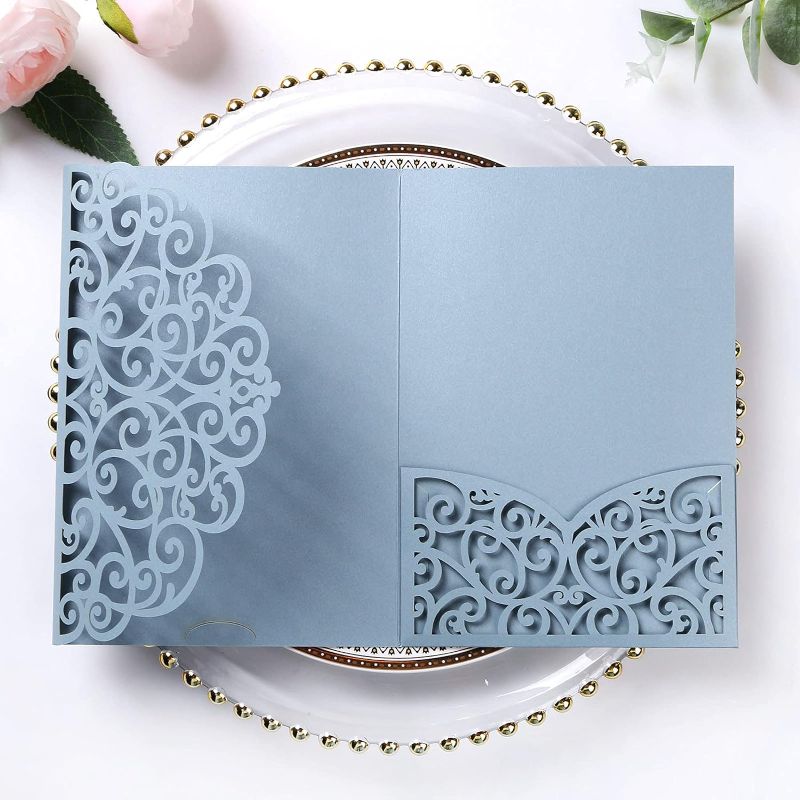 Photo 1 of PONATIA 5.12 x 7.2 Dusty Blue Laser Cut Invitation Pocket, 20PCS Tri-Fold 5 x 7 Laser Cut Wedding Invitation Pockets with Envelopes for Wedding Bbay Shower Birthday Sweet 16 Invite (No Inner Sheet)