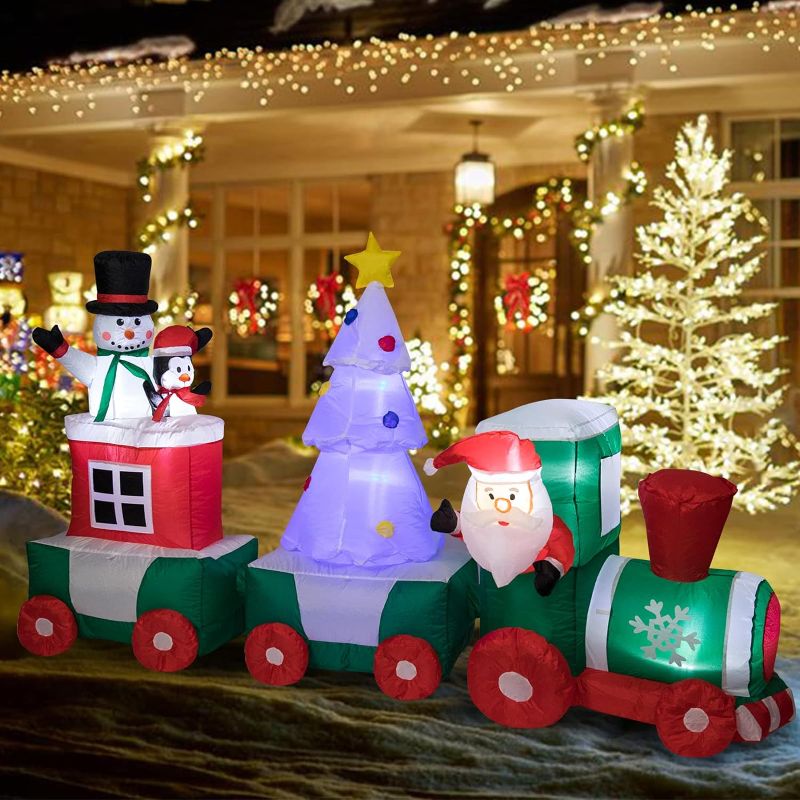 Photo 1 of Christmas Inflatables Decorations Santa Claus Snowman Penguin on Train 7.87 ft Long Inflatable Train Outdoor Decoration with LED Lights Blow Up Christmas Decorations for Yard Lawn Garden Xmas Decor