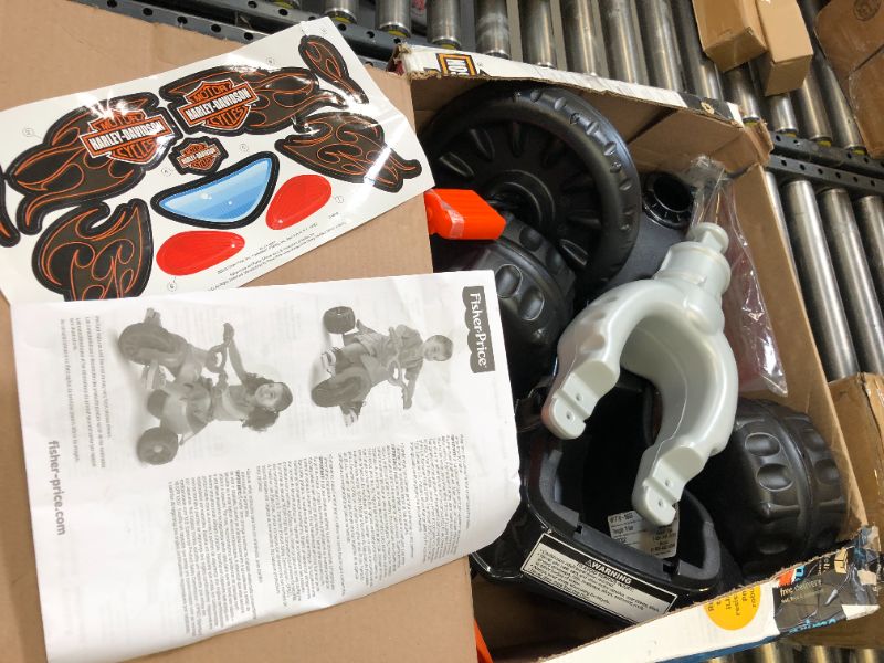 Photo 2 of Fisher-Price Harley-Davidson Tricycle with Handlebar Grips and Storage Area, Multi-Terrain Tires, Tough Trike [Amazon Exclusive] Harley - Davidson