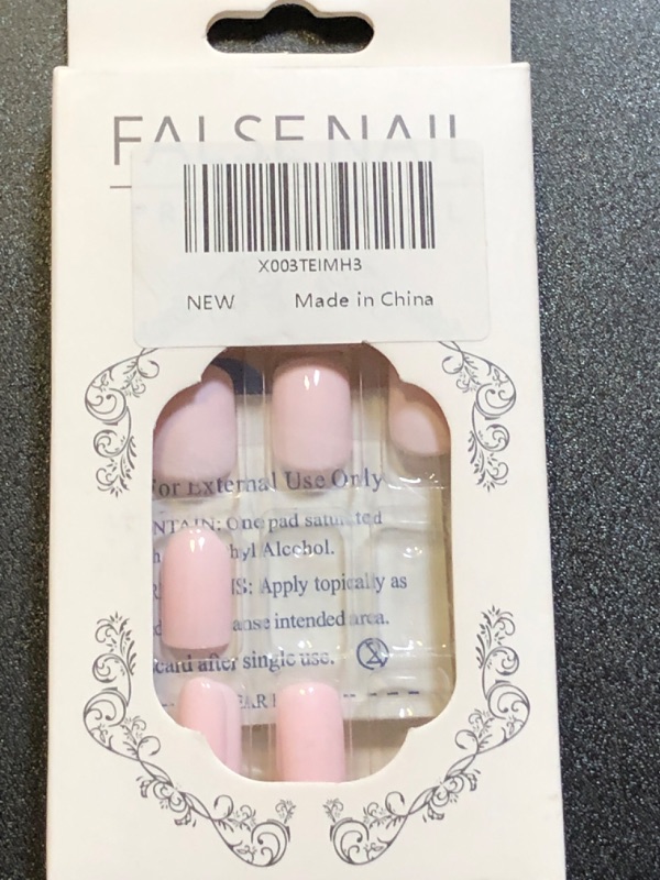 Photo 1 of pink short press on nails 