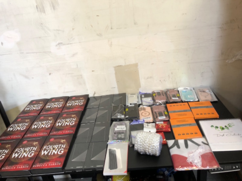 Photo 1 of mystery box lot filled with new and or used items mostlyphone cases and books  items do vary on size and style + color sold as is no returns or exchanges  