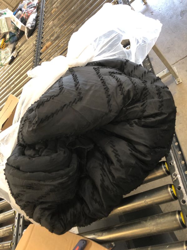 Photo 1 of black comforter - unknown size 