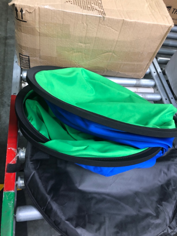 Photo 1 of Blue Screen Green Screen Backdrop Double Sided Collapsible Green Screen with Carrying Bag,Portable Pop Up Green Screen Background for Streaming Webcam (Blue Green Screen, 39.4 * 59.1")