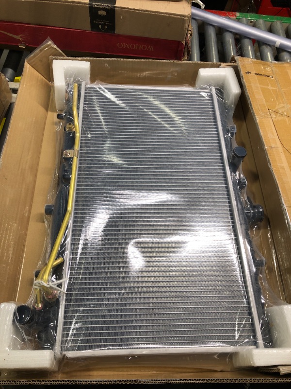 Photo 1 of Radiator for RAD2170 New Replacement Radiator Fits 2000-2005 Ford Excursion 
***Picture taken is what is looks like brand new in package***