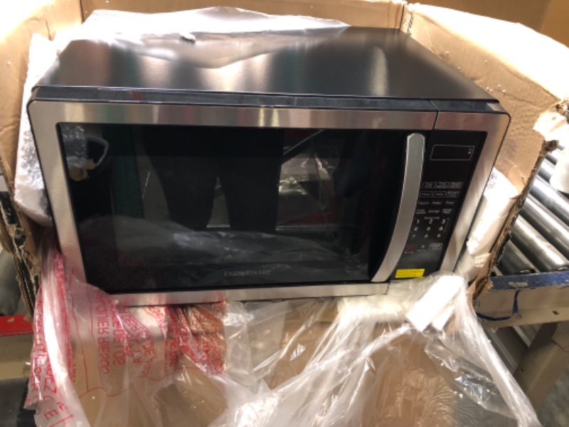 Photo 3 of **FOR PARTS**Farberware Countertop Microwave 1.1 Cu. Ft. 1000-Watt Compact Microwave Oven with LED lighting, Child lock, and Easy Clean Interior, Stainless Steel Interior & Exterior Stainless Steel Microwave Oven