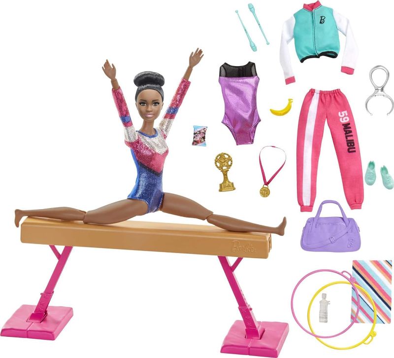 Photo 1 of Barbie Gymnastics Playset with Doll and 15+ Accessories, Twirling Gymnast Toy with Balance Beam, Brunette Doll