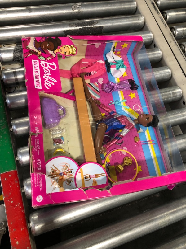 Photo 2 of Barbie Gymnastics Playset with Doll and 15+ Accessories, Twirling Gymnast Toy with Balance Beam, Brunette Doll