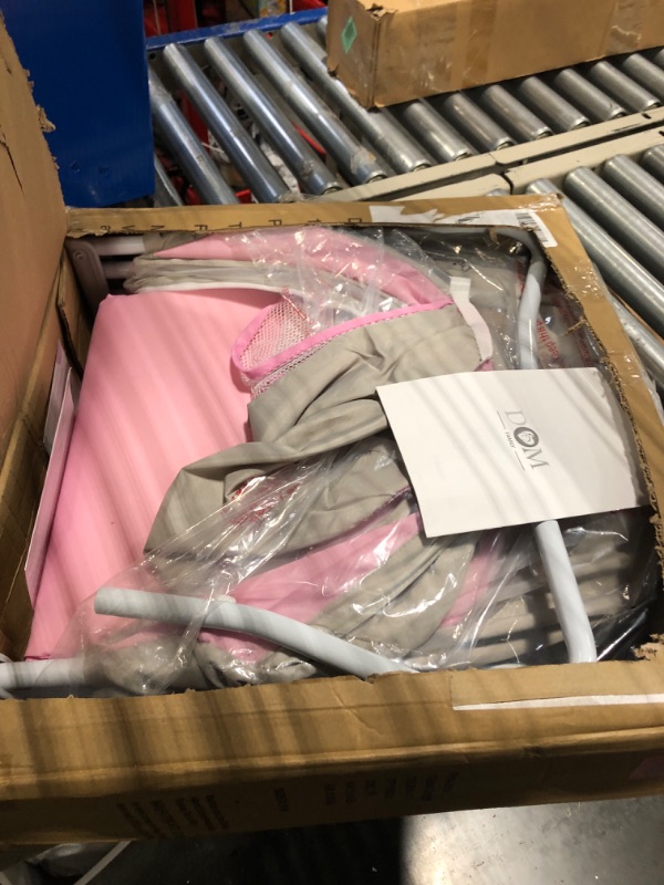 Photo 1 of Dream On Me Karley Bassinet in Grey and Pink, Lightweight Portable Baby Bassinet, Quick Fold and Easy to Carry , Adjustable Double Canopy, Indoor and Outdoor Bassinet with Large Storage Basket. Grey/Pink
