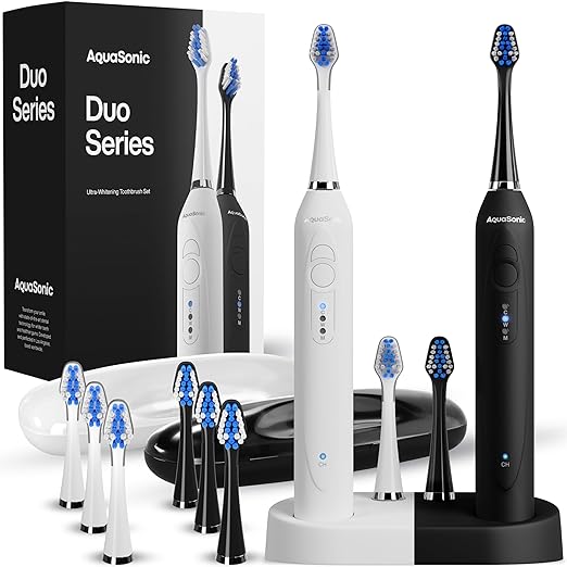 Photo 1 of Aquasonic Duo - Dual Handle Ultra Whitening 40,000 VPM Wireless Charging Electric ToothBrushes - 3 Modes with Smart Timers - 10 Dupont Brush Heads & 2 Travel Cases Included