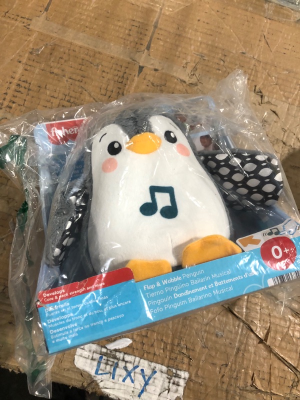 Photo 1 of Fisher-Price Baby Plush Baby Toy Flap & Wobble Penguin with Music and Motion For Tummy Time To Sit-At Sensory Play