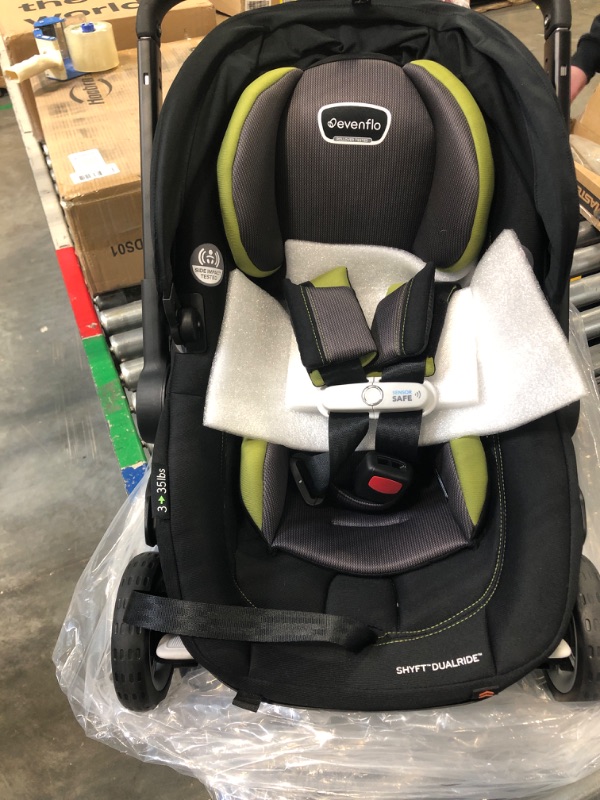Photo 9 of Evenflo Shyft DualRide Infant Car Seat and Stroller Combo with Carryall Storage (Durham Green) Shyft Dualride Durham Green