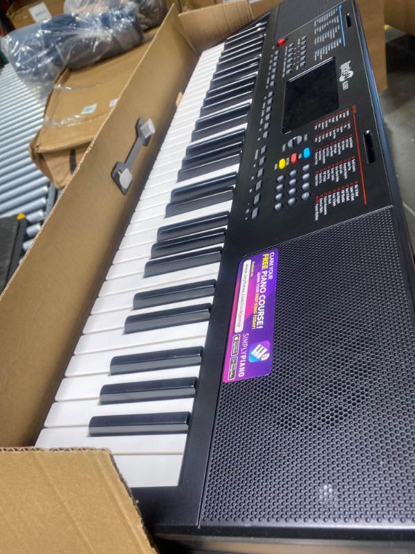 Photo 1 of RockJam Compact 61 Key Keyboard with Sheet Music Stand, Power Supply, Piano Note Stickers & Simply Piano Lessons Compact 61 Key Keyboard Piano Piano