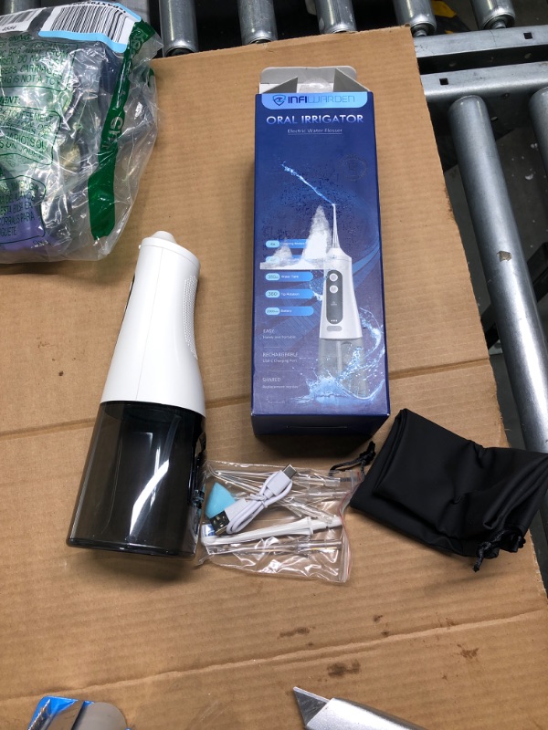 Photo 1 of Cordless Water Flosser Teeth Cleaner Dental Oral Irrigator Picks Portable and Rechargeable 310ml Water Tank IPX7 Water Proof for Home and Travel Infiwarden (White)