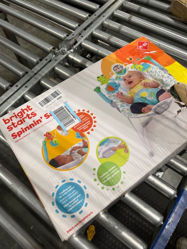 Photo 1 of Bright Starts Spinnin' Safari Vibrating Baby Bouncer Seat with 3-Point Harness and -Toy Bar, Age 0-6 Months