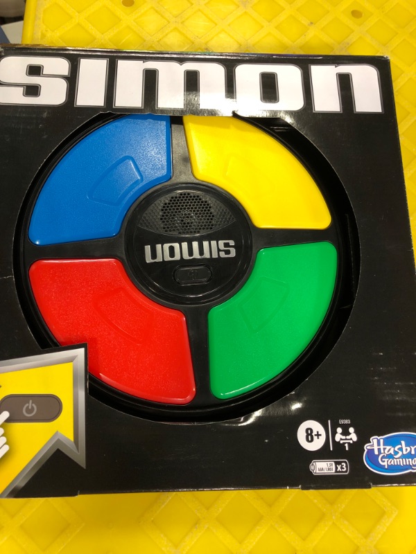 Photo 1 of Basic Fun Simon Electronic Game with Digital Screen and Built-In Counter