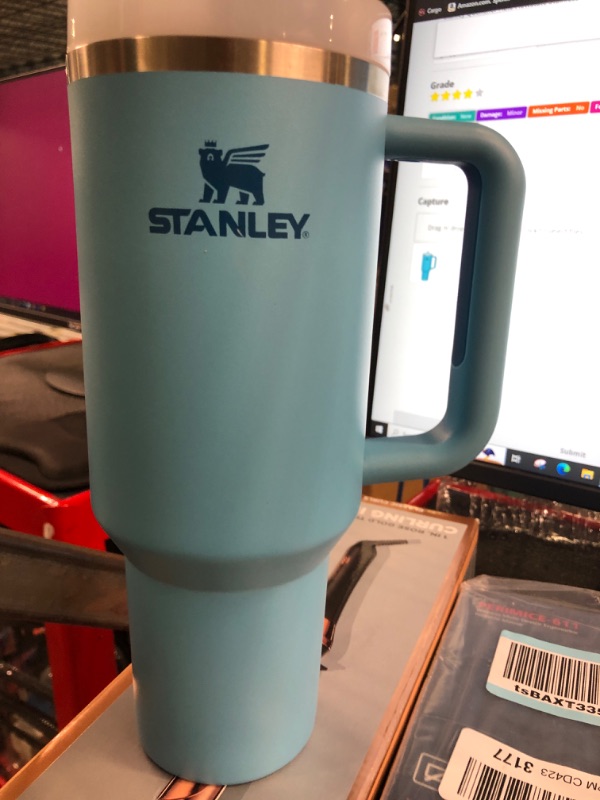 Photo 2 of ***ITEM HAS A DENT*** 

Stanley Quencher H2.0 FlowState Stainless Steel Vacuum Insulated Tumbler with Lid and Straw for Water, Iced Tea or Coffee, Smoothie and More, Pool, 40 Oz 40oz POOL  **HAS A DENT**