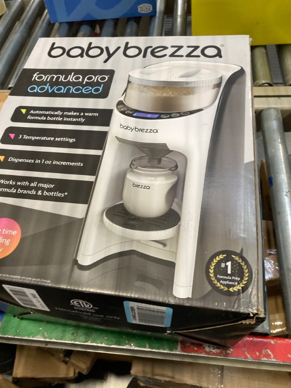 Photo 1 of Baby Brezza New and Improved Formula Pro Advanced Formula Dispenser Machine - Automatically Mix a Warm Formula Bottle Instantly - Easily Make Bottle with Automatic Powder Blending, White
