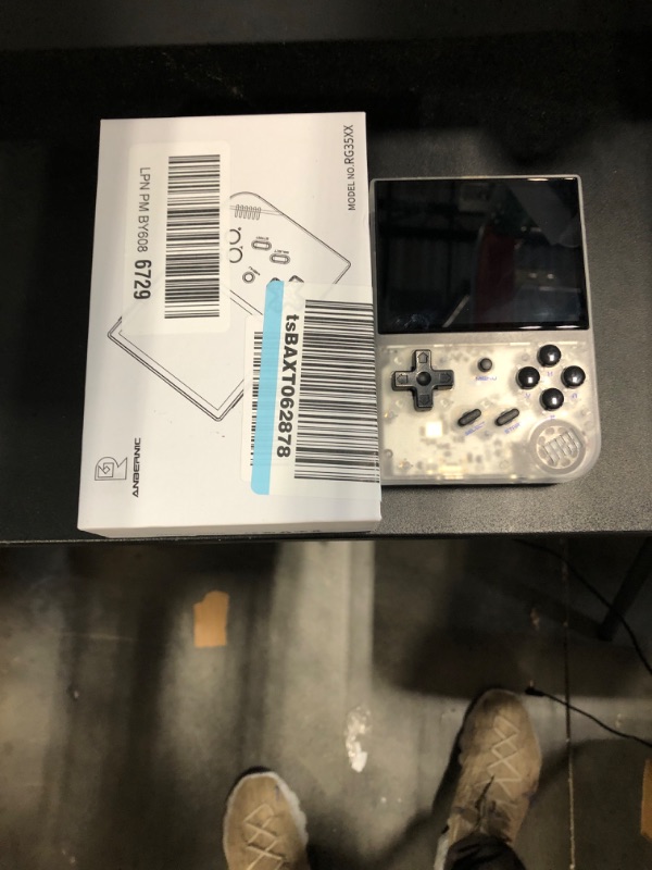 Photo 1 of **FOR PARTS!! DOES NOT TURN ON***RG35XX 2024 Retro Handheld Game Console Linux System HDMI and TV Output 3.5 Inch IPS Screen 64G TF Card 5500+ Classic Games 2600mAh Battery( RG35XX 2024 White) RG35XX+ White