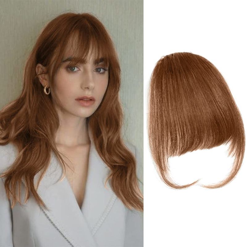 Photo 1 of Clip in Bangs Real Human Hair Wispy Bangs Hair Clip Fringe with Temples Extensions Clip on Flat Neat Air Bangs Natural Curved Bangs Hairpieces for Women(Light Brown)
