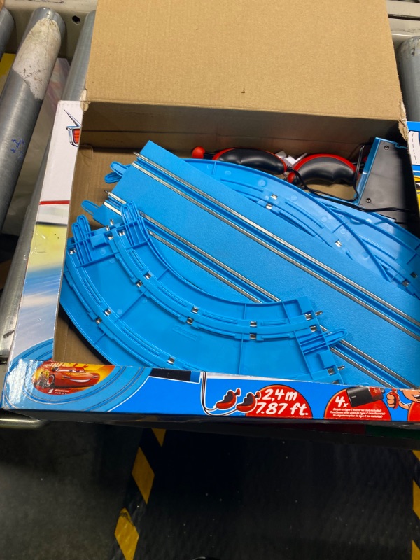 Photo 3 of Carrera First Disney/Pixar Cars - Slot Car Race Track - Includes 2 Cars: Lightning McQueen and Dinoco Cruz - Battery-Powered Beginner Racing Set for Kids Ages 3 Years and Up Disney Cars w/ Spinners