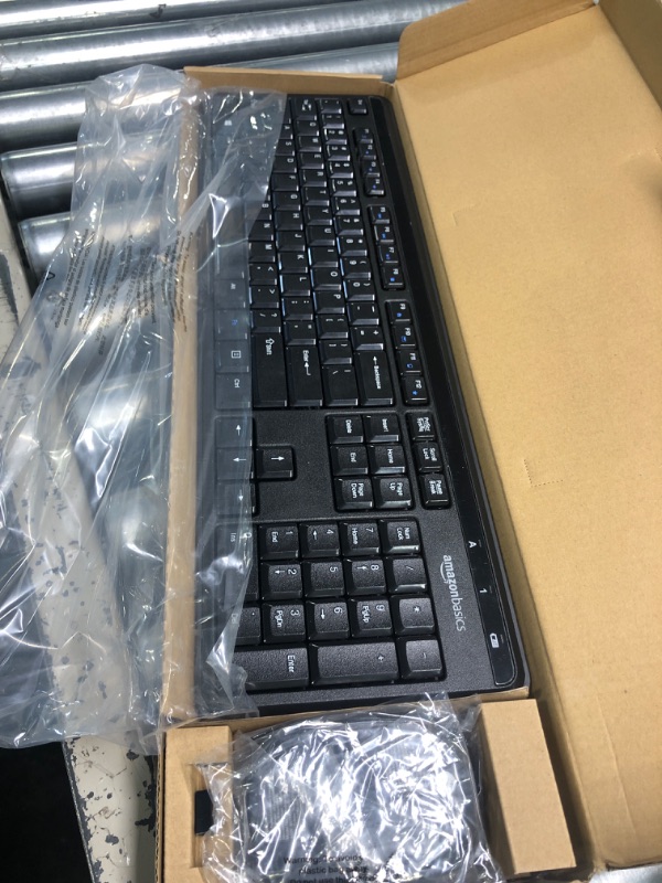 Photo 1 of Amazon Basics Wireless Computer Keyboard and Mouse Combo - Quiet and Compact - US Layout (QWERTY)
