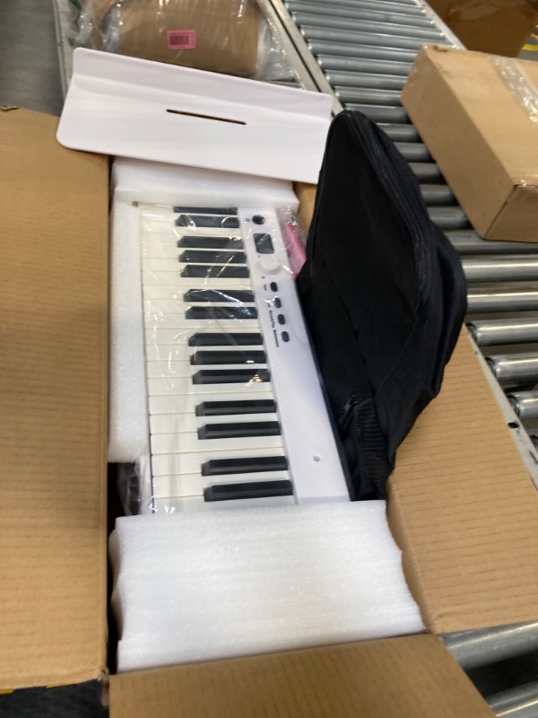 Photo 3 of FVEREY 88 Key Folding Piano Keyboard, Full Size Semi Weighted Keyboard, Travel Piano Portable Musical Keyboard, Support MIDI Bluetooth Electric Piano for Beginners Adults, White 88 Keys white
***New, factory packaging still intact.*** 