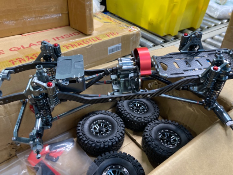 Photo 1 of RC Car Frame, Metal Carbon Fiber RC Car Frame Kit 313mm RC Crawler Tires Wheelbase Set for AXIAL SCX10