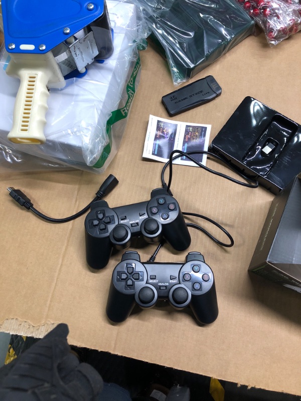 Photo 2 of **uSED**FUNTELL Wireless Retro Game Console, Plug & Play Video TV Game Stick with 15000+ Games Built-in, 64G, 9 Emulators, 4K HDMI Nostalgia Stick Game for TV, Dual 2.4G Wireless Controllers 15000 Games