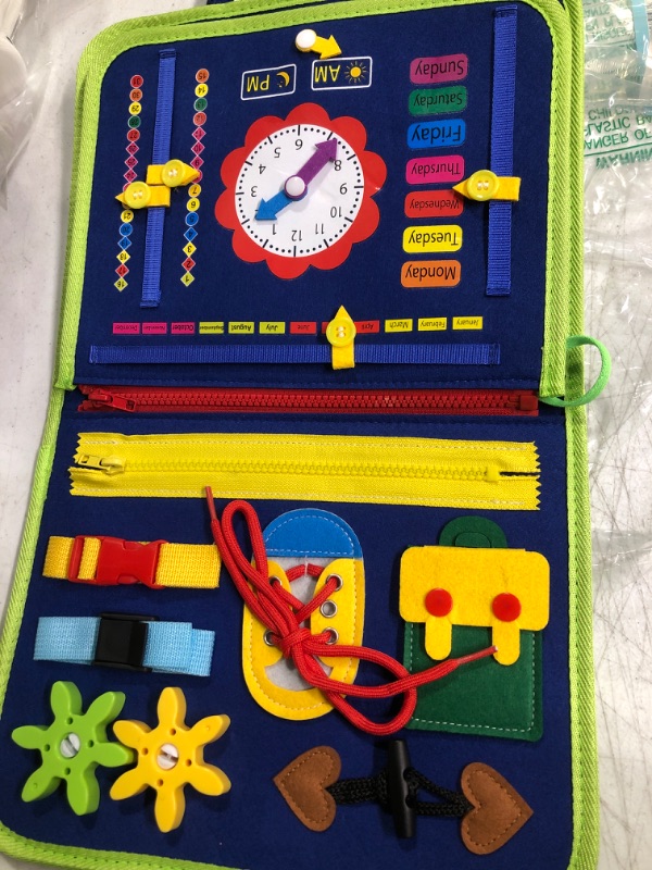 Photo 1 of Guolely Busy Board Montessori Toy for 1 2 3 4 Year Old Toddlers - Educational Activity Developing Sensory Board for Fine Basic Dress Motor Skills - Travel Toys for Plane Car, Gift for Boys Girls Blue