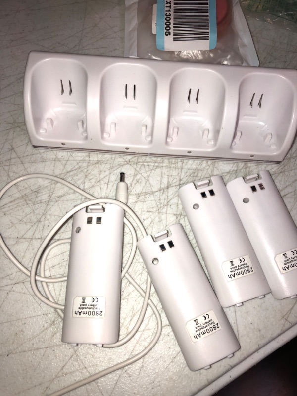 Photo 2 of 4-in-1 Charging Station for Wii&Wii U Remote Controller,Charger with 4 Rechargeable Battery Packs (4 Port Charging Station+4 pcs 2800mAh Replacement Batteries+USB Cable),Remote Not Included