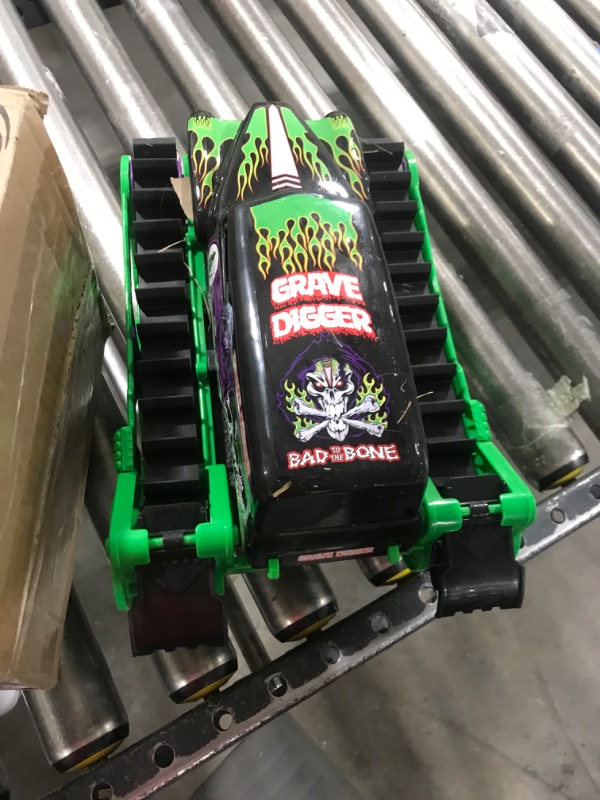 Photo 2 of Monster Jam, Official Grave Digger Trax All-Terrain Remote Control Outdoor Vehicle, 1:15 Scale, Kids Toys for Boys and Girls Ages 4 and up Grave Digger Trax (Retail Packaging)
