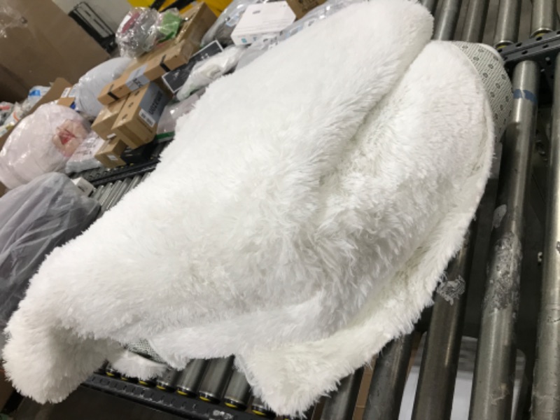 Photo 1 of LARGE WHITE FUR RUG UNKNOWN AREA SIZE 