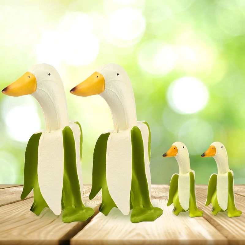 Photo 1 of Barydat 4 Pcs Banana Duck Decor Statue Creative Resin Banana Duck Sculpture Funny Whimsical Peeled Yellow Banana Duck Art Figurine for Yard Outdoor Home Garden Lawn Patio Office Gifts(Green) https://a.co/d/3ttBmON