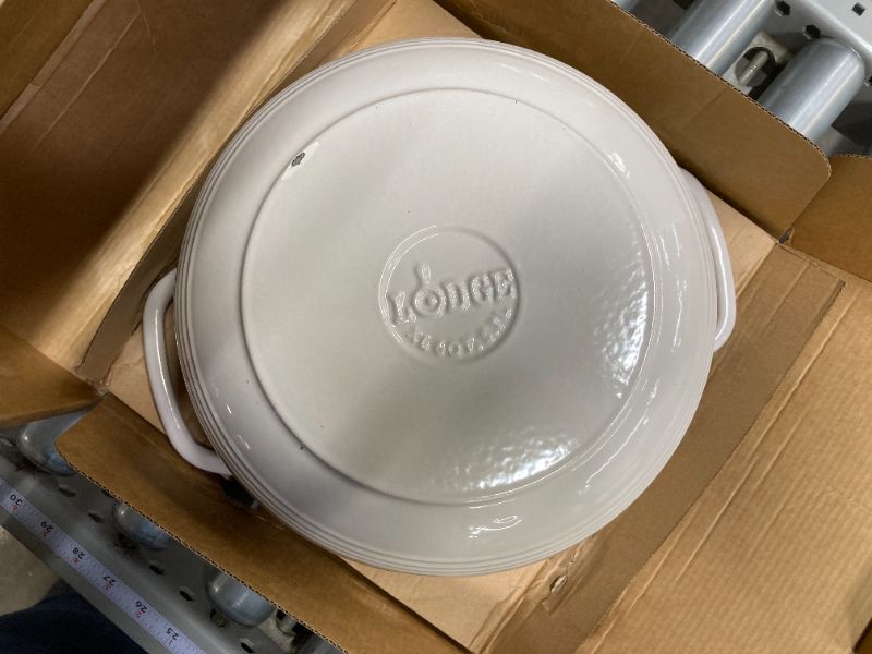 Photo 2 of Lodge 6 Quart Enameled Cast Iron Dutch Oven with Lid – Dual Handles – Oven Safe up to 500° F or on Stovetop - Use to Marinate, Cook, Bake, Refrigerate and Serve – Oyster White