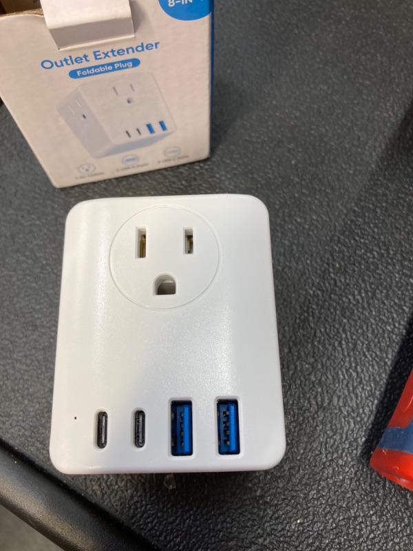 Photo 2 of Travel Plug Adapter foldable Plug