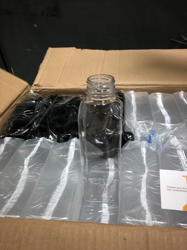 Photo 1 of Tomnk 100pcs 16oz Plastic Juice Bottles with Black Caps Empty Reusable Clear Bottles with Label, Funnel and Brush Beverage Containers for Juicing, Smoothies, Tea, Milk, Drinking, Beverages 16 Ounce (100 Pack)
