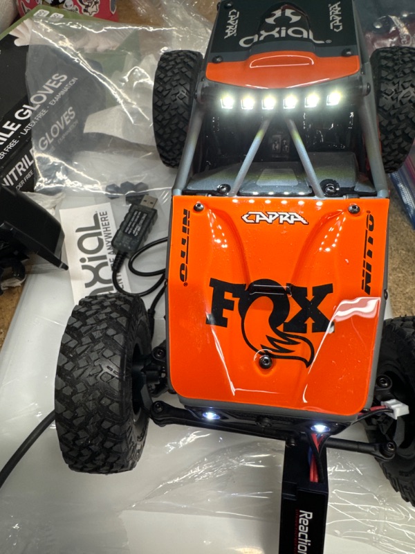 Photo 2 of Axial RC Crawler 1/18 UTB18 Capra 4 Wheel Drive Unlimited Trail Buggy RTR (Battery and Charger Included) Grey, AXI01002T2,Grey/Orange