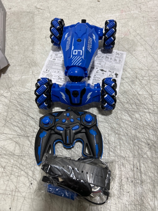 Photo 2 of LOOZIX Upgraded Hand Gesture Sensing RC Stunt Car with Lights Music, Spray Fog Steam Gesture RC Car Remote Controll Transformed Vehicle 360° Spins All Terrains Monster Truck for Boys Kids Blue Medium