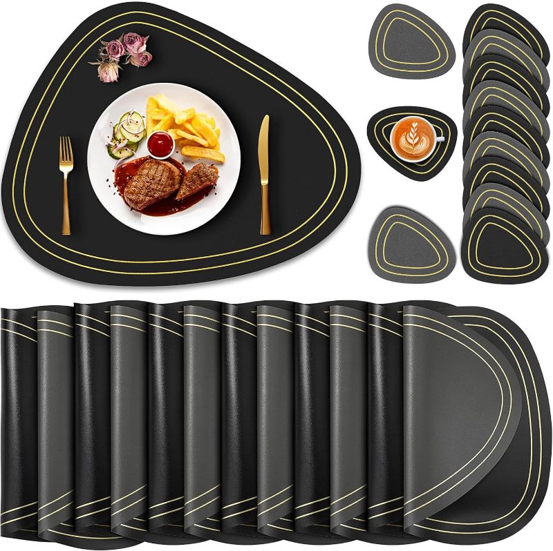 Photo 1 of Sunnychicc Placemats Set of 12 with Coasters Faux Leather Placemats Dual Sided Black Place Mats Resistant Waterproof Washable Table Mats for Kitchen Dining Table Indoor Outdoor