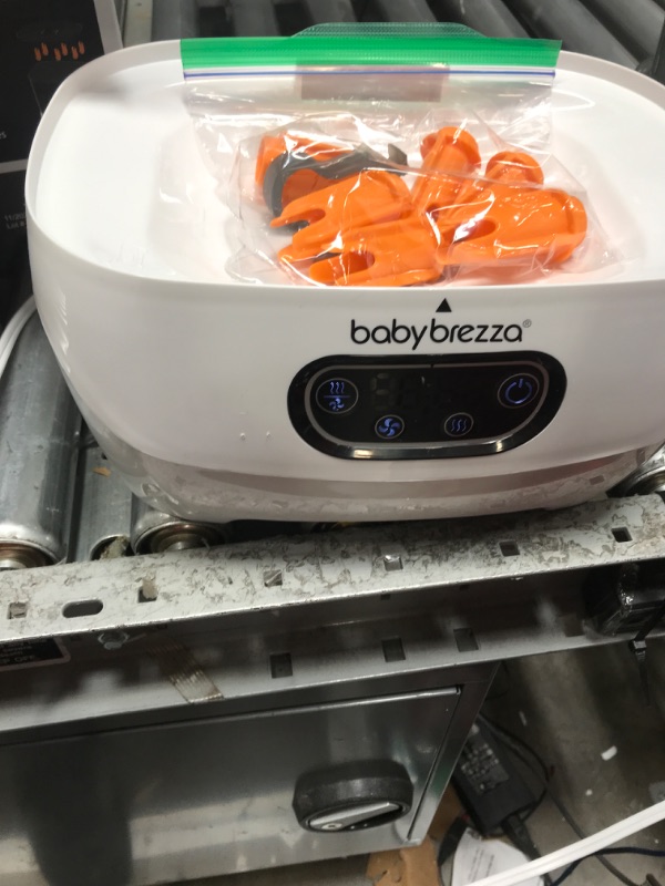 Photo 2 of Baby Brezza Bottle Sterilizer and Dryer Advanced – HEPA Filter And Steam Sterilization – Dries 33 Percent Faster Then Original - Universal Fit up to 8 Baby Bottles And 2 Sets of Pump Parts (Any Brand) Sterilizer-Dryer Advanced