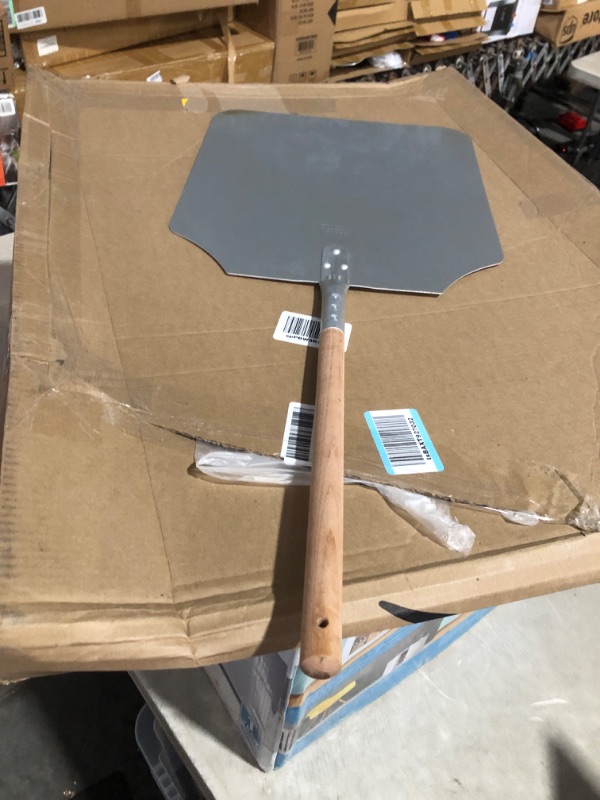 Photo 2 of ***USED - SCRATCHED AND DIRTY - SEE PICTURES***
New Star Foodservice 50196 Aluminum Pizza Peel, Wooden Handle, 16 x 18 inch Blade, 36 inch overall