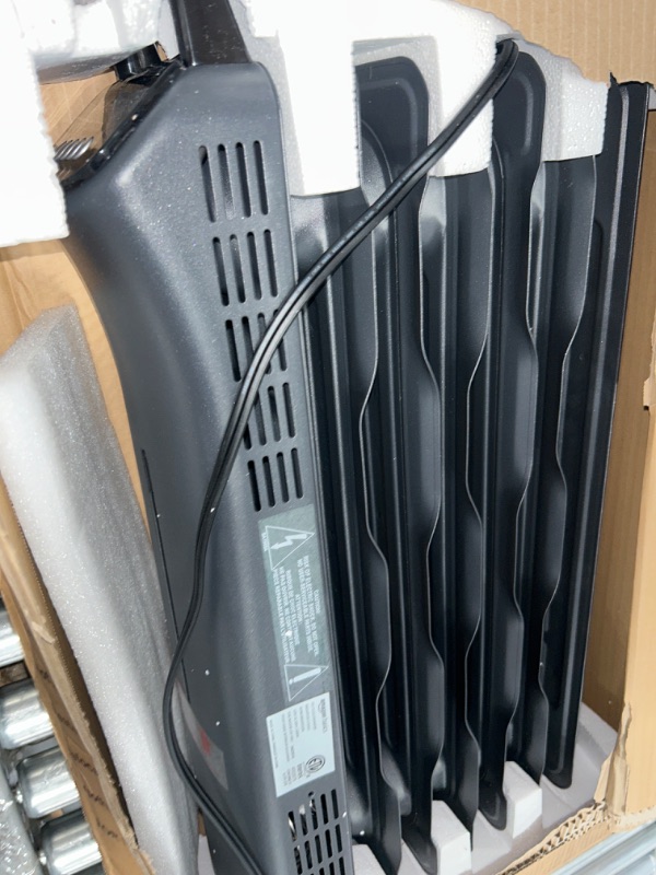 Photo 2 of ***NONREFUNDABLE - NOT FUNCTIONAL - FOR PARTS ONLY - SEE COMMENTS***
Amazon Basics Indoor Portable Radiator Heater, 1500 W, Black