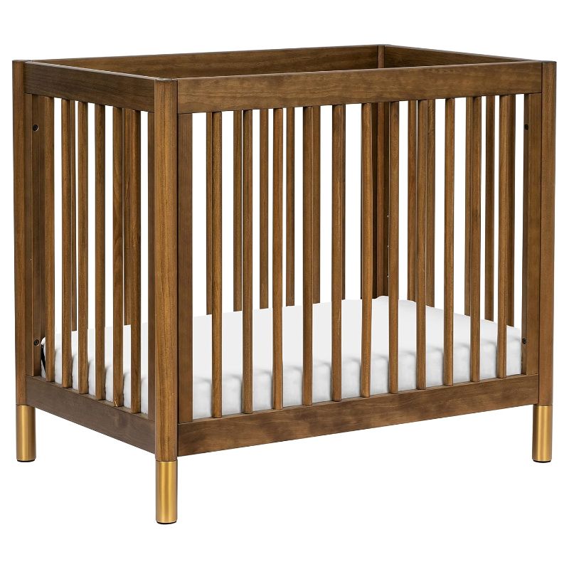 Photo 1 of Babyletto Gelato 4-in-1 Convertible Mini Crib in Natural Walnut and Brushed Gold Feet