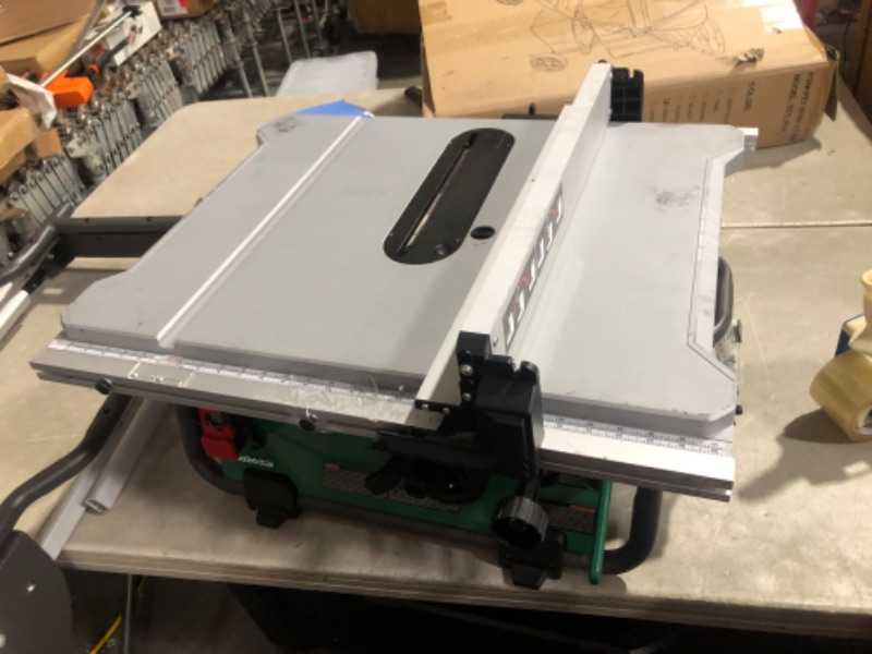 Photo 6 of ***MAJOR DAMAGE - SEE COMMENTS***
Metabo HPT Table Saw | 10-Inch Blade | 35-Inch Rip Capacity | Fold & Roll Stand | 8 x 13/16-Inch Dado Capacity | C10RJS