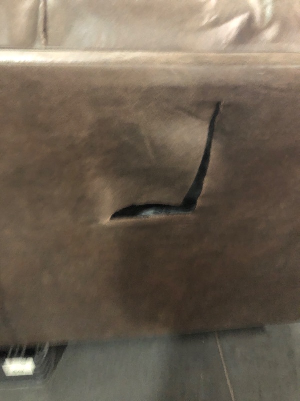 Photo 4 of *** SEE PHOTOS-MINOR HOLE IN THE BACKSIDE OF COUCH-MAJOR DAMAGE TO LOVE SEAT BASE- TRUCK/TRAILER PICKUP ONLY***
Signature Design by Ashley Bladen Faux Leather Full Sofa Sleeper, Brown WITH Signature Design by Ashley Bladen Faux Leather Loveseat, Brown