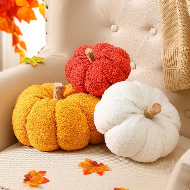 Photo 1 of 3 Pcs Thanksgiving Pumpkin Pillow Plush Pumpkin Throw Pillow 3D Sherpa Pumpkin Decoration Stuffed Fall Decorative Pillows Cushion for Thanksgiving Bedroom Couch Sofa Car (The pillows are a different color they are brown, green, & tan)