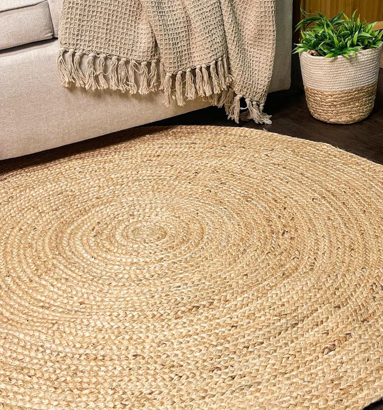 Photo 1 of Chardin home Jute Braided Boho Round Rug Natural Jute, 4 feet Round Farmhouse Jute Area Rug, Artisanal Bohemian Handcrafted Home Décor, Perfect for Living Room, Bedroom, Dining Room and Study
